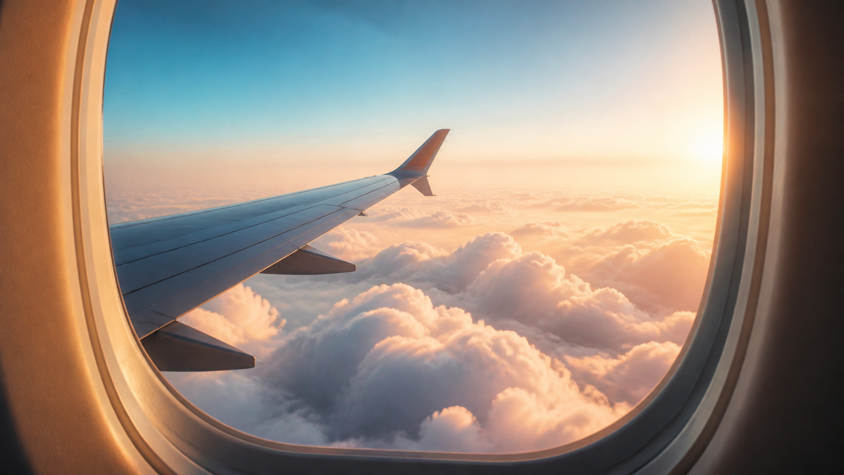 Airplane wing above clouds